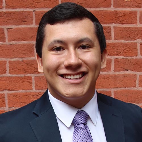 An informal portrait of young researcher, he is smiling at the camera