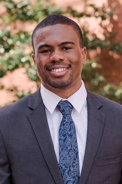 An informal portrait of young researcher, he is smiling at the camera