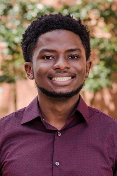 An informal portrait of young researcher, he is smiling at the camera