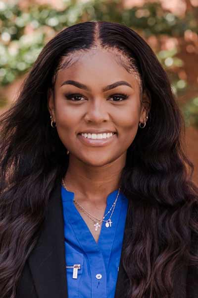 An informal portrait of young researcher, she is smiling at the camera