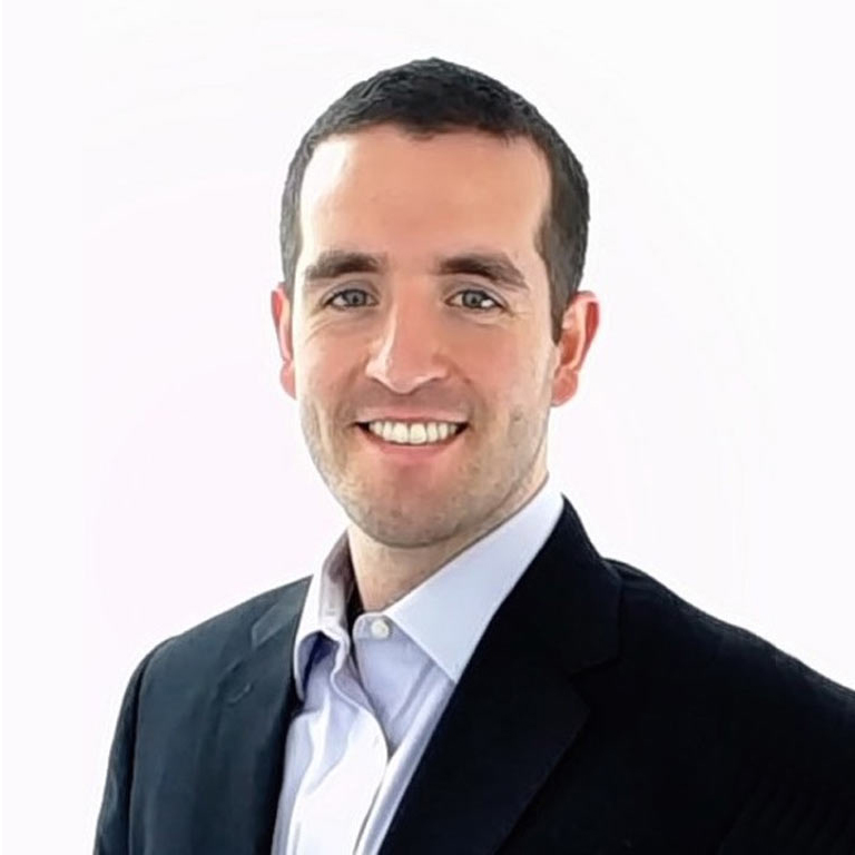 A formal portrait of young researcher, he is smiling at the camera