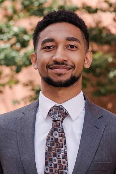 An informal portrait of young researcher, he is smiling at the camera