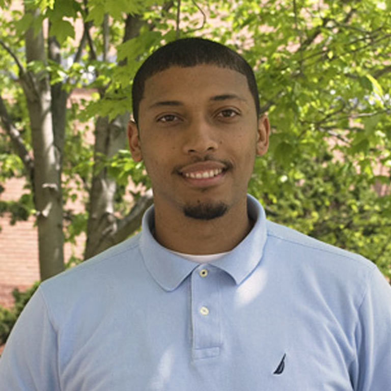An informal portrait of young researcher, he is smiling at the camera