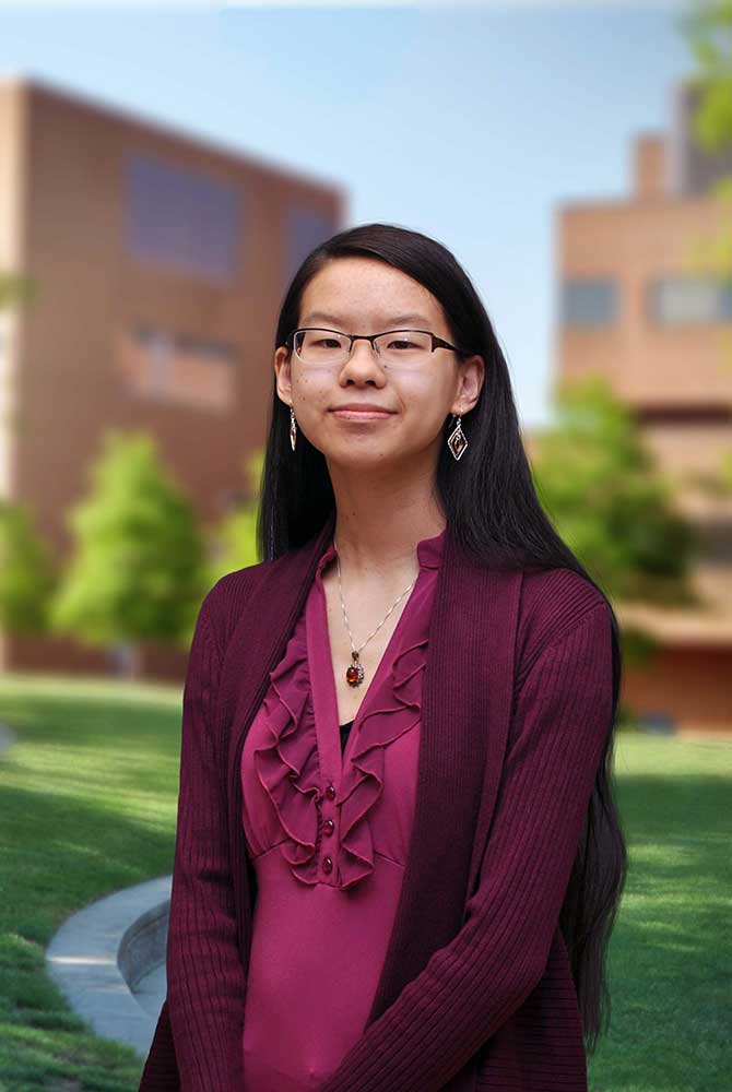 An informal portrait of young researcher, she is smiling at the camera